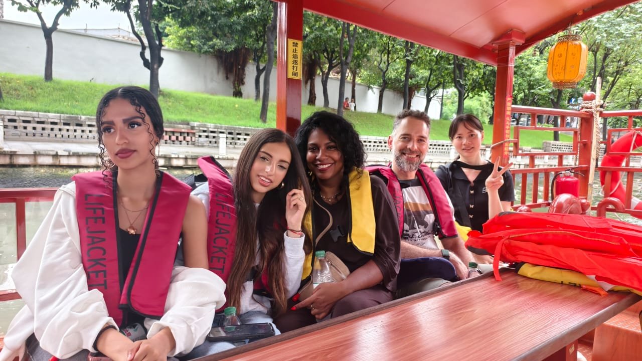 Tina and international guests enjoying a boat ride on Lychee Bay in Guangzhou